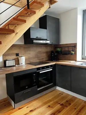 Cuisine ou kitchenette dans l'établissement Le duplex Cornadore