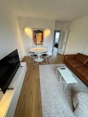 Télévision ou salle de divertissement dans l'établissement Le renouveau