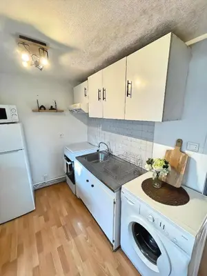 Cuisine ou kitchenette dans l'établissement La Mansarde - Cœur Historique, Charme et Confort