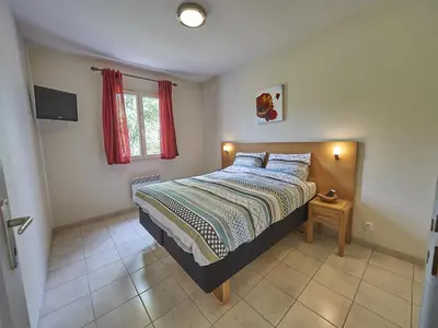 Un ou plusieurs lits dans un hébergement de l'établissement Bungalow in Lanzac near Dordogne River