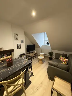 Télévision ou salle de divertissement dans l'établissement La Villa Louana 4 Appartement neuf et moderne tout confort