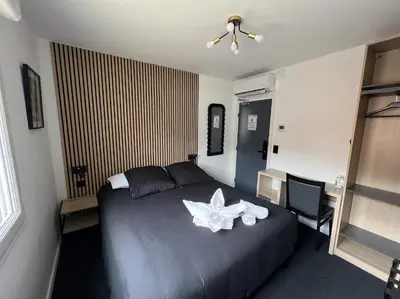 Un ou plusieurs lits dans un hébergement de l'établissement Hotel Le royal