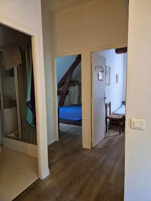 Un ou plusieurs lits dans un hébergement de l'établissement La maison du bord de l'eau plage de baignade