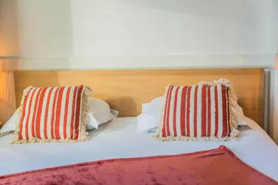 Un ou plusieurs lits dans un hébergement de l'établissement Dalissimo - 1 Chambre