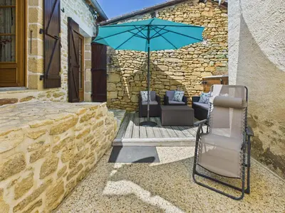 Coin salon dans l'établissement Escapade à 2 sur Auriac avec jardin cosy