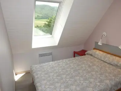 Un ou plusieurs lits dans un hébergement de l'établissement Gite 8 Vacances en Auvergne Gîte au Puy Mary avec Activités de Plein Air