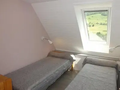 Coin salon dans l'établissement Gite 8 Vacances en Auvergne Gîte au Puy Mary avec Activités de Plein Air