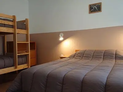 Un ou plusieurs lits dans un hébergement de l'établissement Gîte 20 PMR - Confort et Accessibilité au Cœur du Parc des Volcans d'Auvergne