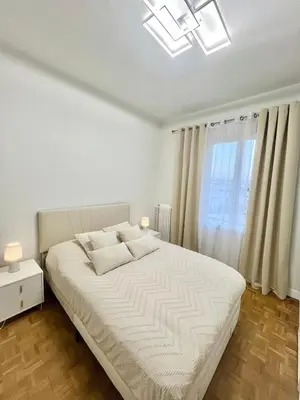 Un ou plusieurs lits dans un hébergement de l'établissement Bel appartement centre ville
