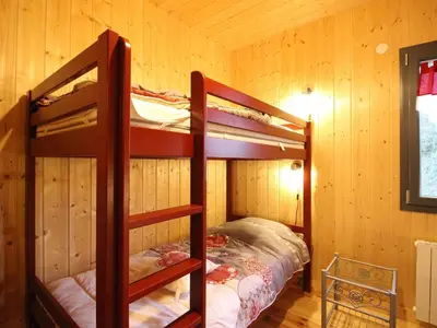 Un ou plusieurs lits dans un hébergement de l'établissement Chalet moderne au Mont-Dore, 8 pers, terrasse, proximité centre - FR-1-608-286