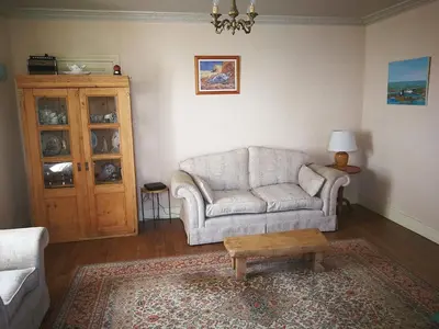 Coin salon dans l'établissement La appartement des rosiers