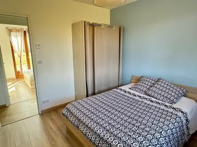 Un ou plusieurs lits dans un hébergement de l'établissement Maison de plain pied 3 chambres