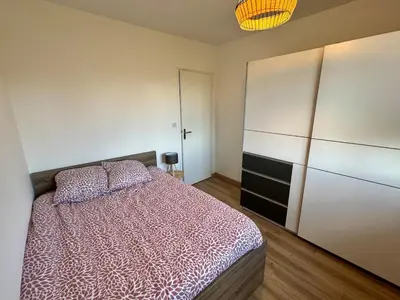 Un ou plusieurs lits dans un hébergement de l'établissement Maison de plain pied 3 chambres