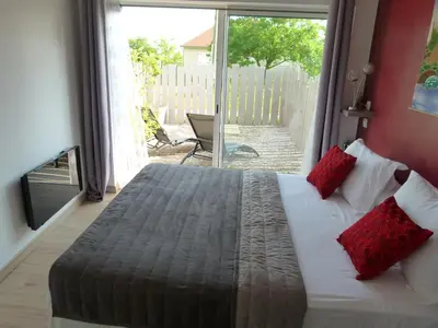 Un ou plusieurs lits dans un hébergement de l'établissement Chambre d'hôtes du Pilou