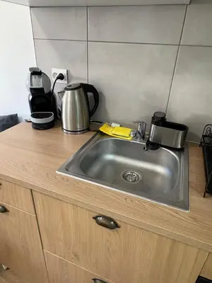 Cuisine ou kitchenette dans l'établissement Les balcons du 115 BIS - Appartement standing