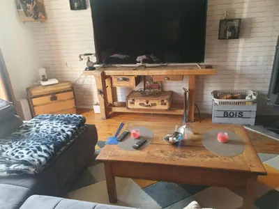 Télévision ou salle de divertissement dans l'établissement Maison