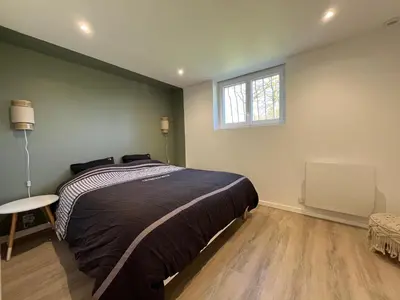 Un ou plusieurs lits dans un hébergement de l'établissement La parenthèse, confortable appartement 2 pièces