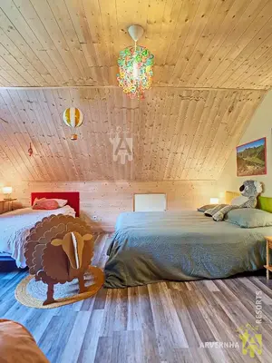 Un ou plusieurs lits dans un hébergement de l'établissement Chalet Les Mélèzes