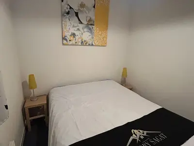 Un ou plusieurs lits dans un hébergement de l'établissement Appartement Sud avec Terrasse et Garage à Super Besse - FR-1-814-96