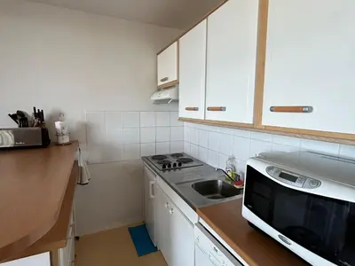 Cuisine ou kitchenette dans l'établissement Appartement 6 pers proche pistes et commerces - FR-1-814-95