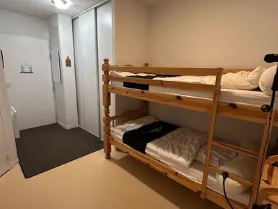 Un ou plusieurs lits dans un hébergement de l'établissement Appartement 6 pers proche pistes et commerces - FR-1-814-95