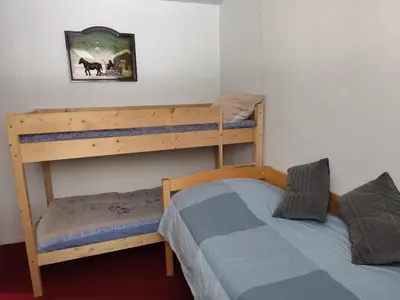 Un ou plusieurs lits dans un hébergement de l'établissement Appartement au Cœur de Super Besse avec Balcon et Parking - FR-1-814-98