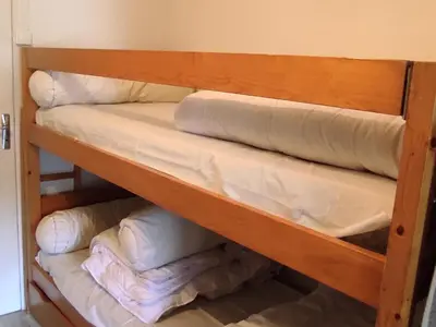 Un ou plusieurs lits dans un hébergement de l'établissement Studio Centre Station Ski - Balcon, 2 à 4 Pers. - FR-1-814-117
