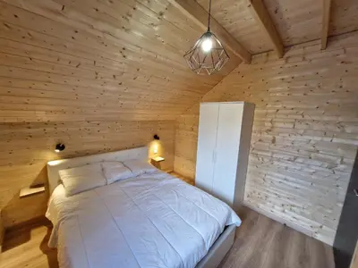 Un ou plusieurs lits dans un hébergement de l'établissement Chalet moderne pour 14 pers avec parking privé - FR-1-814-121