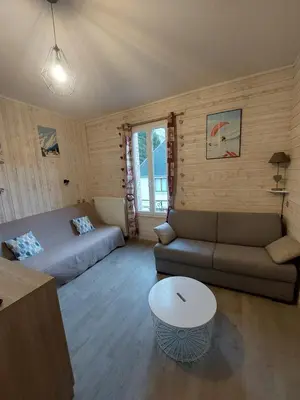 Coin salon dans l'établissement Charmant appartement - Le Mont Dore