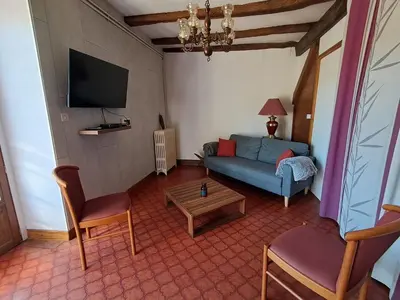 Télévision ou salle de divertissement dans l'établissement gîte Le Pressoir