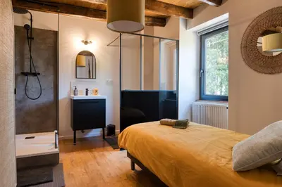 Un ou plusieurs lits dans un hébergement de l'établissement Chambres d'hôtes Le tour du Lot