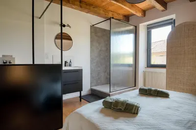 Un ou plusieurs lits dans un hébergement de l'établissement Chambres d'hôtes Le tour du Lot
