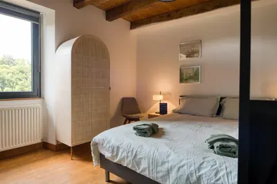 Un ou plusieurs lits dans un hébergement de l'établissement Chambres d'hôtes Le tour du Lot