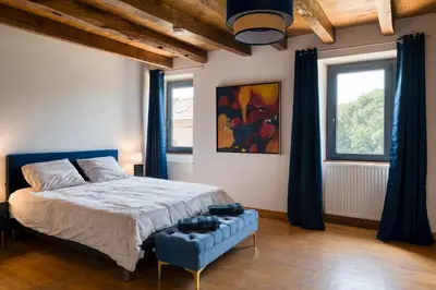 Un ou plusieurs lits dans un hébergement de l'établissement Chambres d'hôtes Le tour du Lot