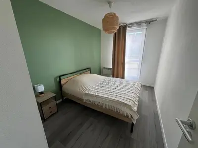 Un ou plusieurs lits dans un hébergement de l'établissement Appartement Sully