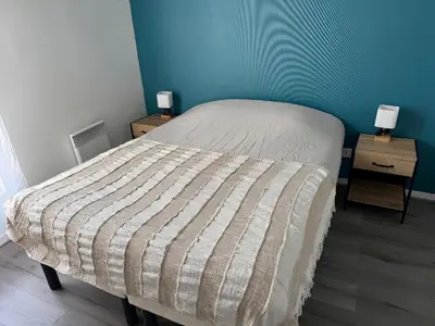 Un ou plusieurs lits dans un hébergement de l'établissement Appartement Sully