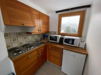 Cuisine ou kitchenette dans l'établissement Super Lioran T2 dernier étage