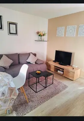 Télévision ou salle de divertissement dans l'établissement Appartement 2-4 pers