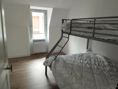 Un ou plusieurs lits dans un hébergement de l'établissement Appartement Vic-sur-Cère