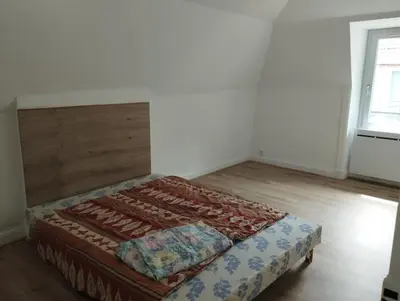 Un ou plusieurs lits dans un hébergement de l'établissement Appartement Vic-sur-Cère