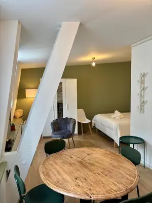 Un ou plusieurs lits dans un hébergement de l'établissement Casa Bondy - Studio - Coeur de ville de Brive