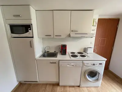 Cuisine ou kitchenette dans l'établissement Studio central au Lioran avec terrasse et parking - FR-1-787-125