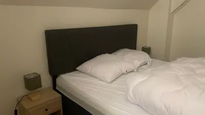 Un ou plusieurs lits dans un hébergement de l'établissement Appartement cosy wifi à deux pas des Thermes