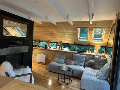 Coin salon dans l'établissement Le 36 Chalet 6 pers Le Mont-Dore Sauna Ski Hiking