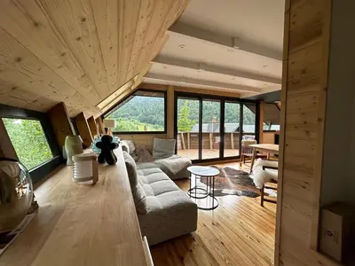 Coin salon dans l'établissement Le 36 Chalet 6 pers Le Mont-Dore Sauna Ski Hiking