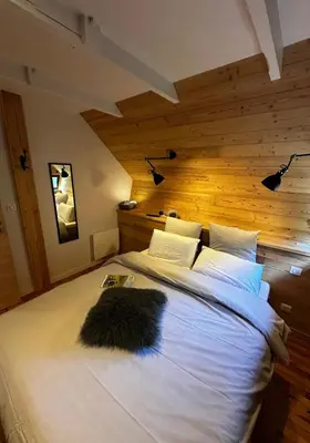 Un ou plusieurs lits dans un hébergement de l'établissement Le 36 Chalet 6 pers Le Mont-Dore Sauna Ski Hiking