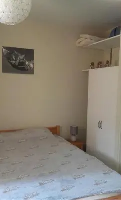 Un ou plusieurs lits dans un hébergement de l'établissement Appt au lioran à Laveissiere, 6pers, 1 chambre, lits superposés et canapé
