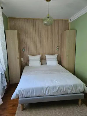 Un ou plusieurs lits dans un hébergement de l'établissement Chambres hôtes du Pont Lafont