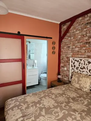 Un ou plusieurs lits dans un hébergement de l'établissement Chambres hôtes du Pont Lafont