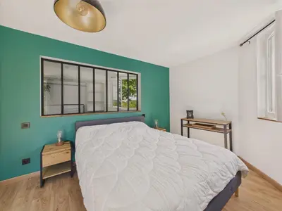 Un ou plusieurs lits dans un hébergement de l'établissement Grand jardin et terrasse - maison pour 7